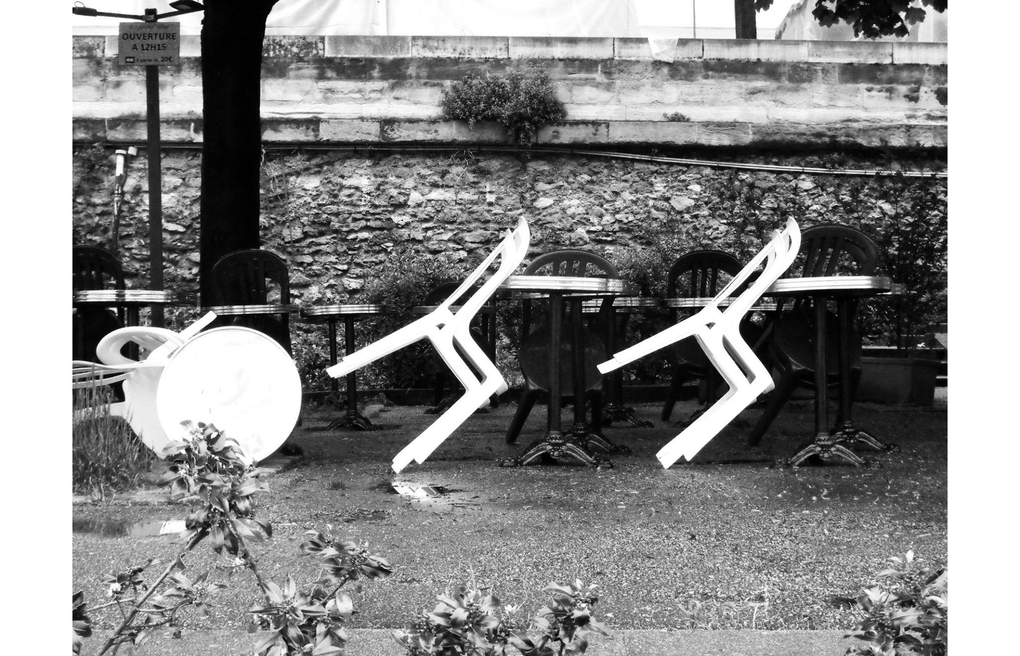 Conceptual reference image accompanying the Eos Apex Earrings from the Renaissance Collection of chairs in a black and white image taken by river Seine in paris
