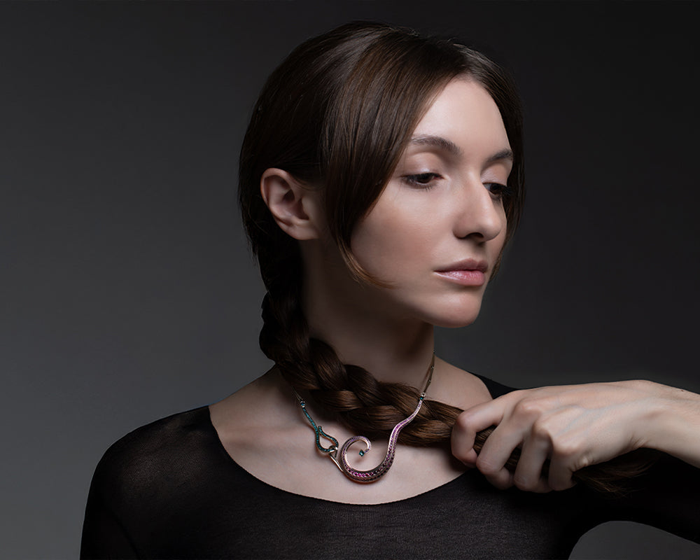 Ananke Lovelace Necklace worn, showing scale, suspension, and coloured diamond articulation. Photography by Raquel Pellicano and Humberto Lemos.