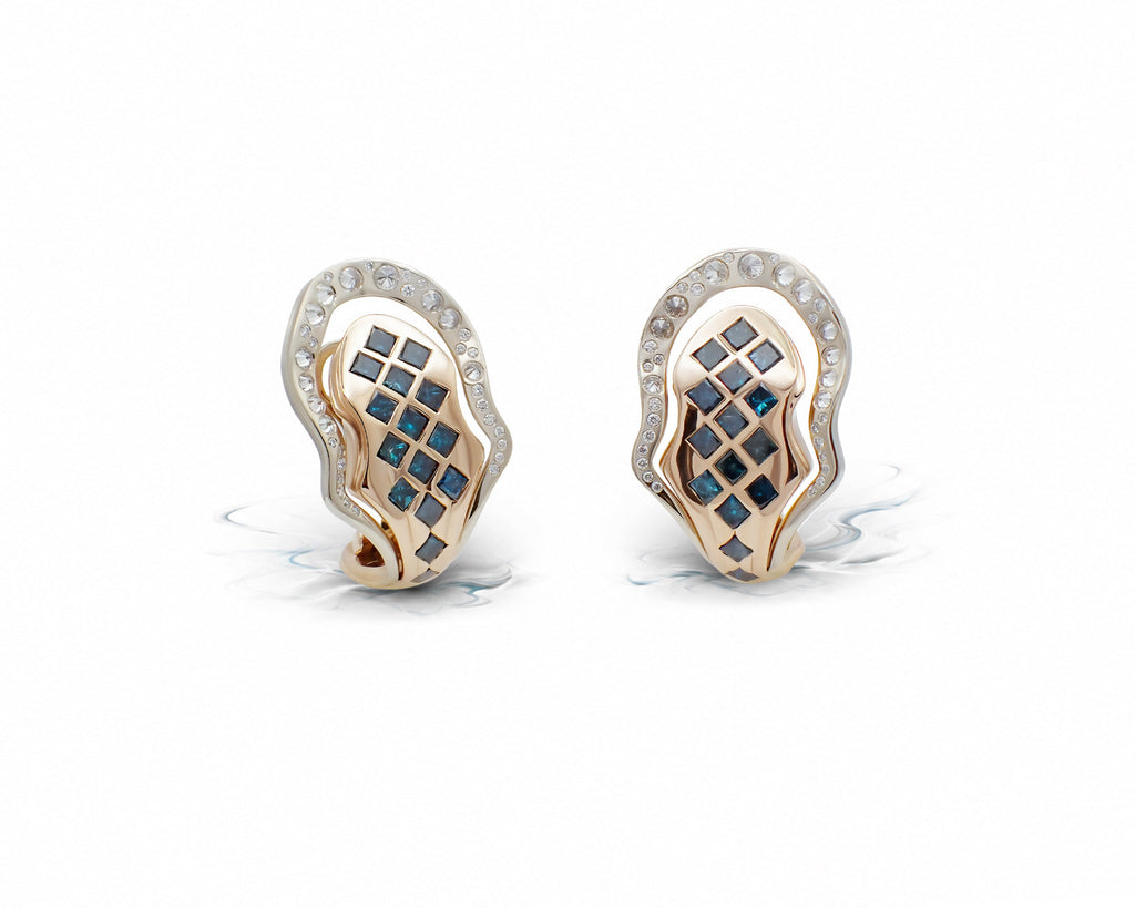Eos Apex Earrings shown from the front, reverse-set diamonds and oceanic blue accents across the beige and rose gold form.