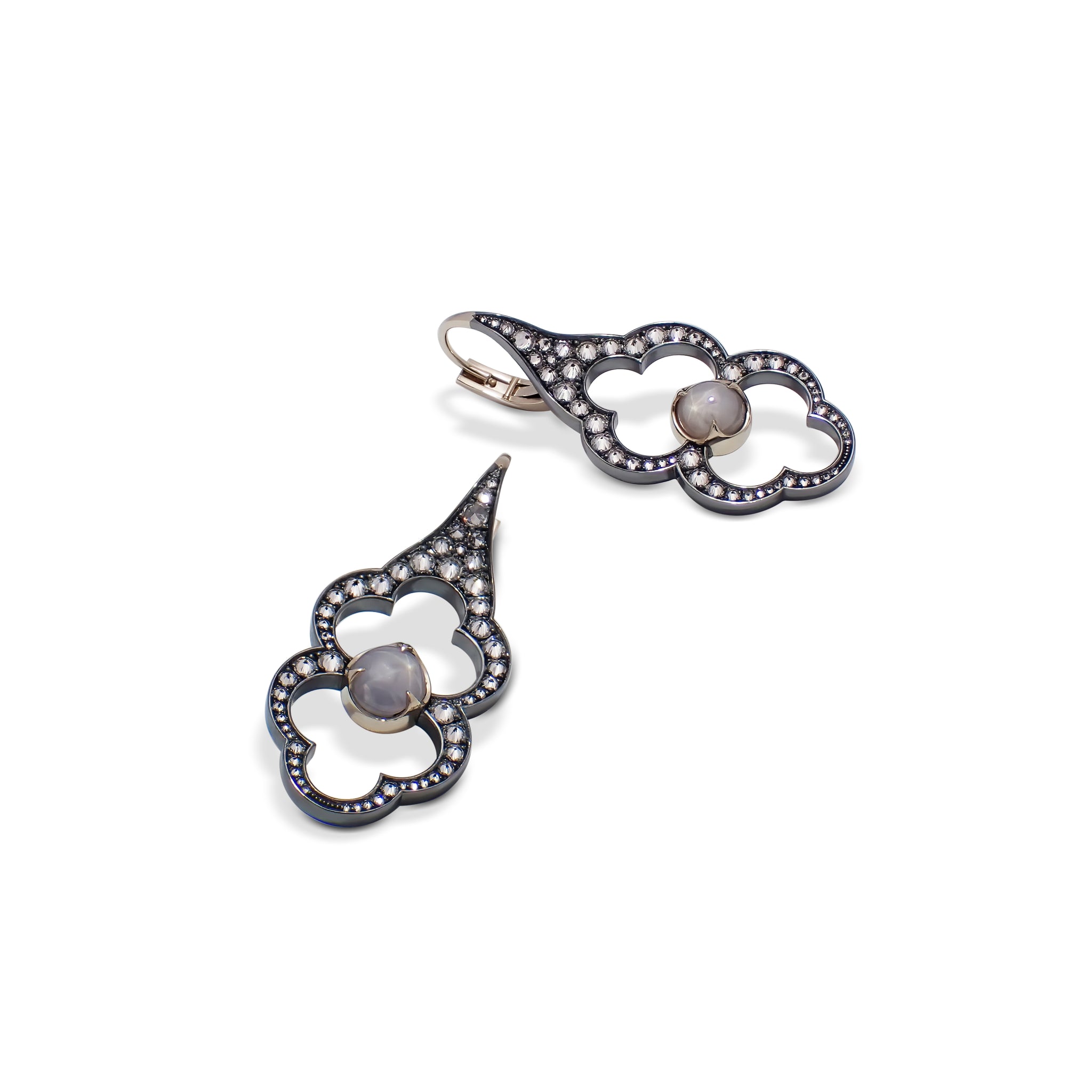 Parhelion Earrings by Hugo Cahill set with Ceylon star sapphires and brilliant-cut diamonds in darkened silver
