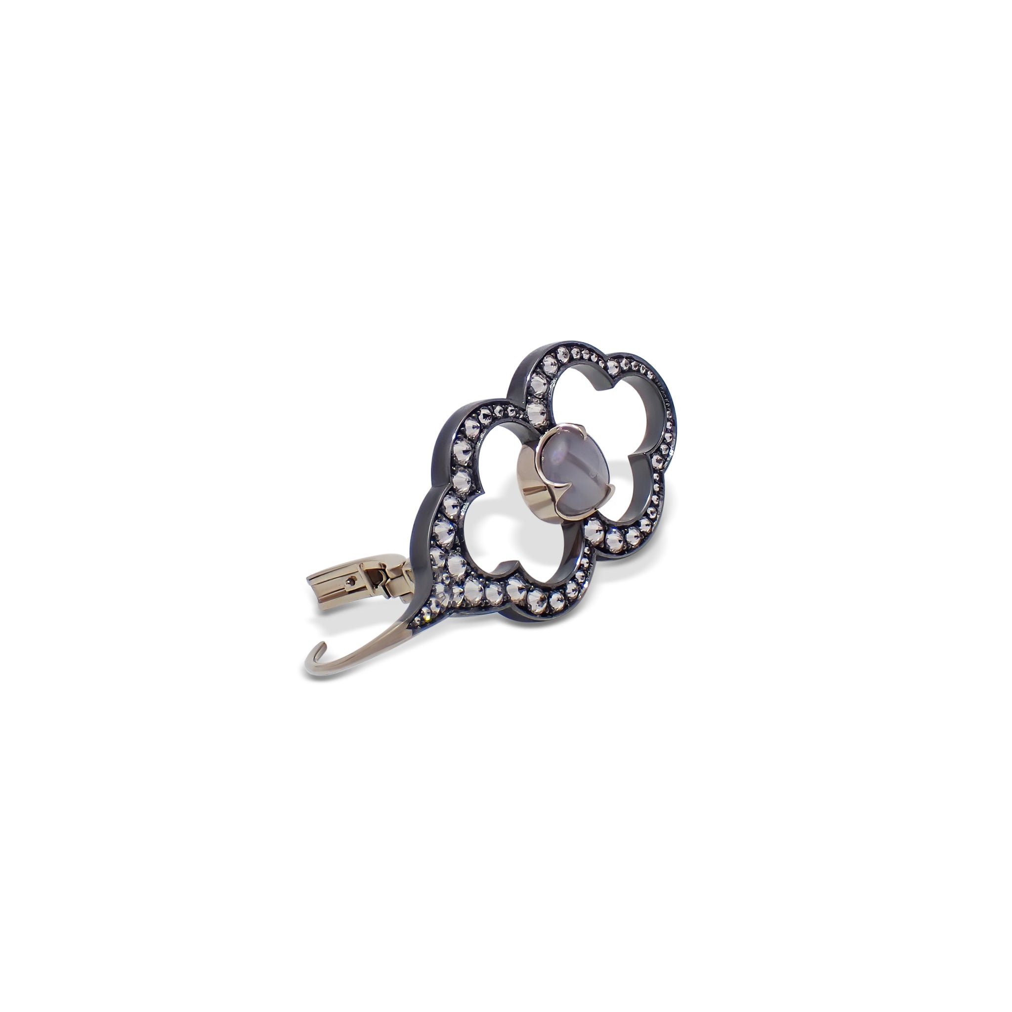 Detail view of a Parhelion Earring highlighting the star sapphire cabochon and diamond setting
