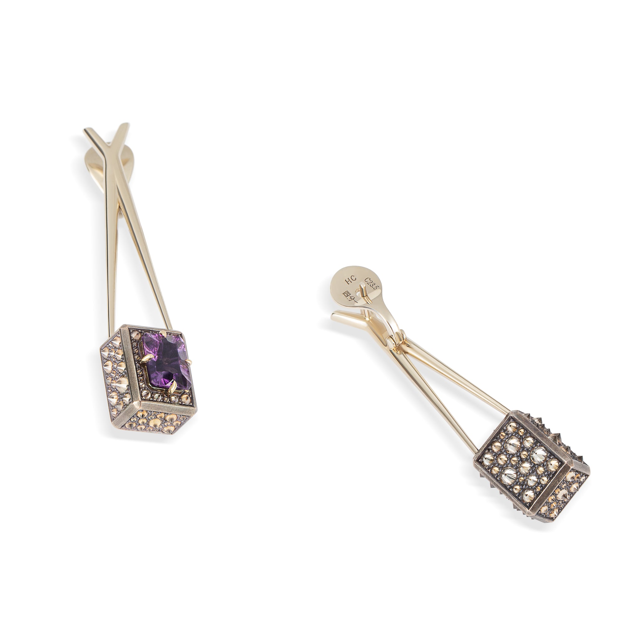Atlas Spur Earrings by Hugo Cahill in beige gold and shibuichi, set with fancy-cut amethysts and reverse-set diamonds

