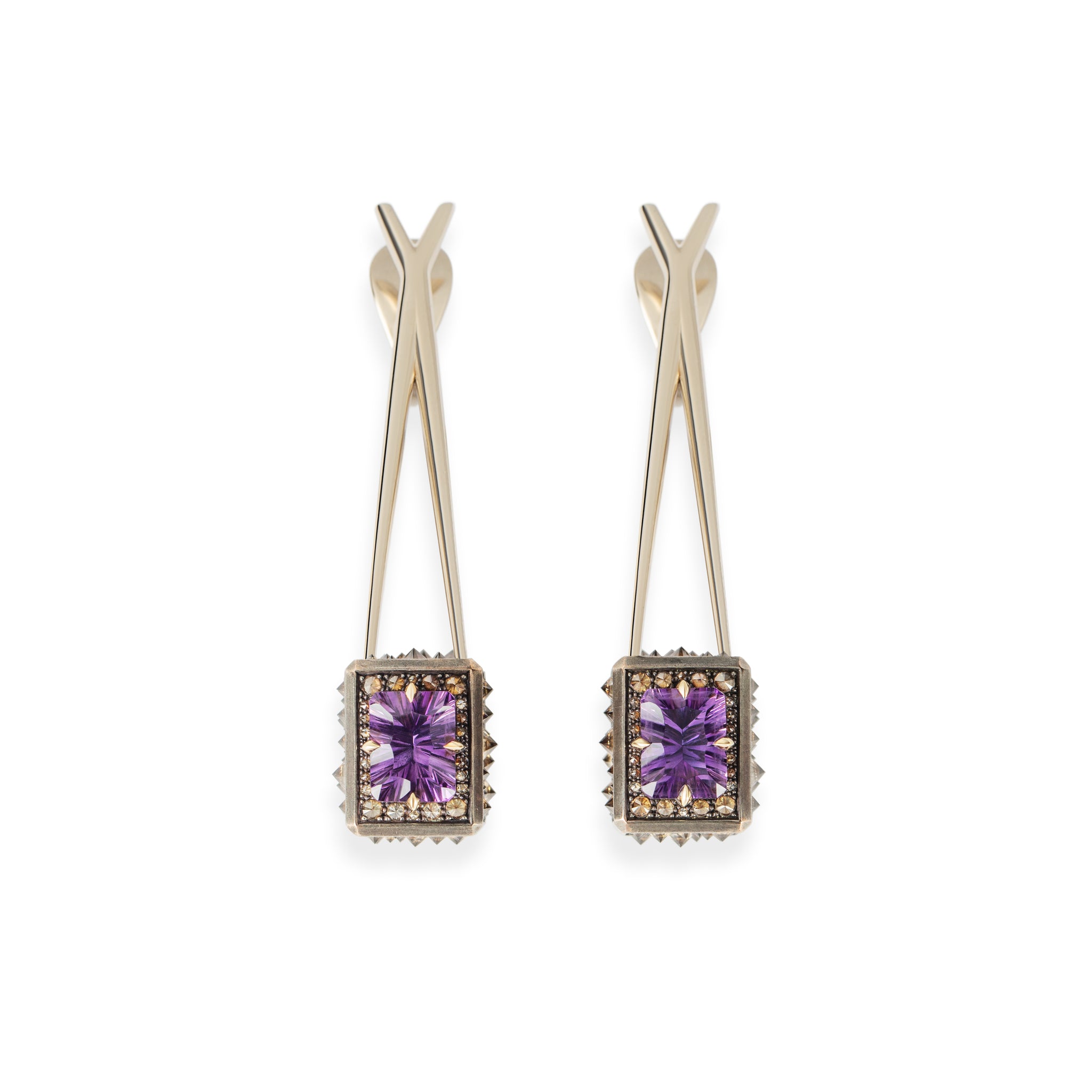 Front view of the Atlas Spur Earrings highlighting faceted amethyst geometry and vertical tension
