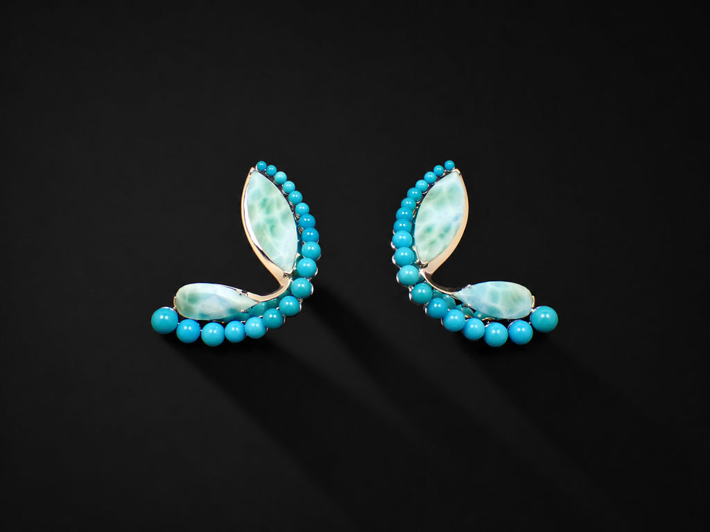 Halcyon Arc Earrings shown from the front, marquise and pear-cut larimar set in white gold with graduated turquoise cabochons.