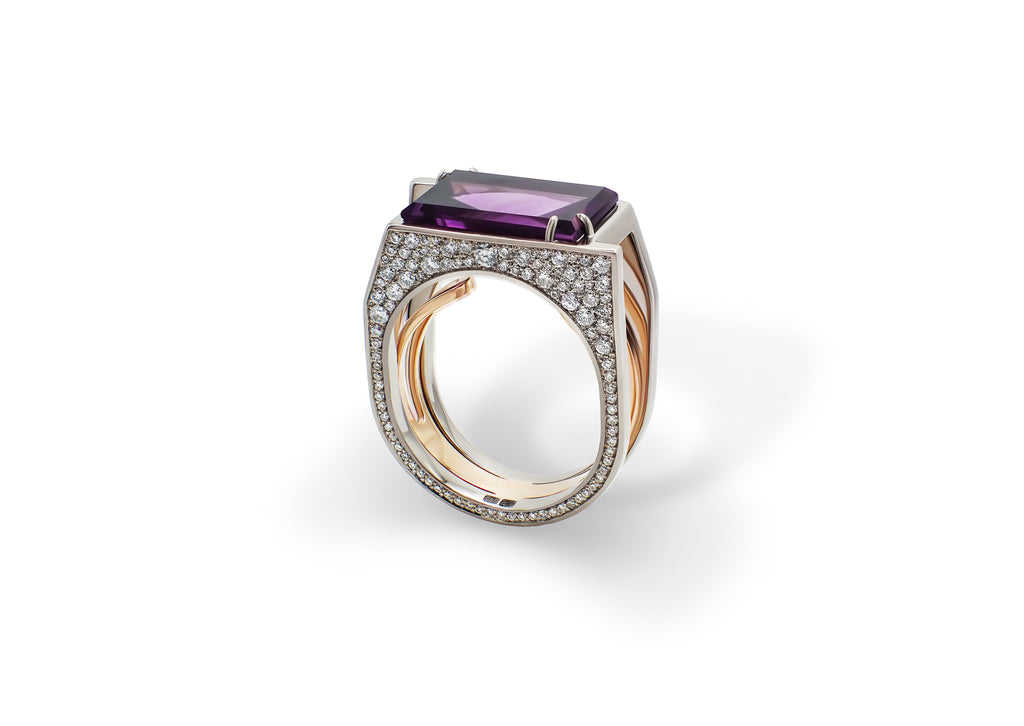 Oumuamua Ring shown at an angle, the baguette-cut amethyst framed by a diamond snowflake pavé.