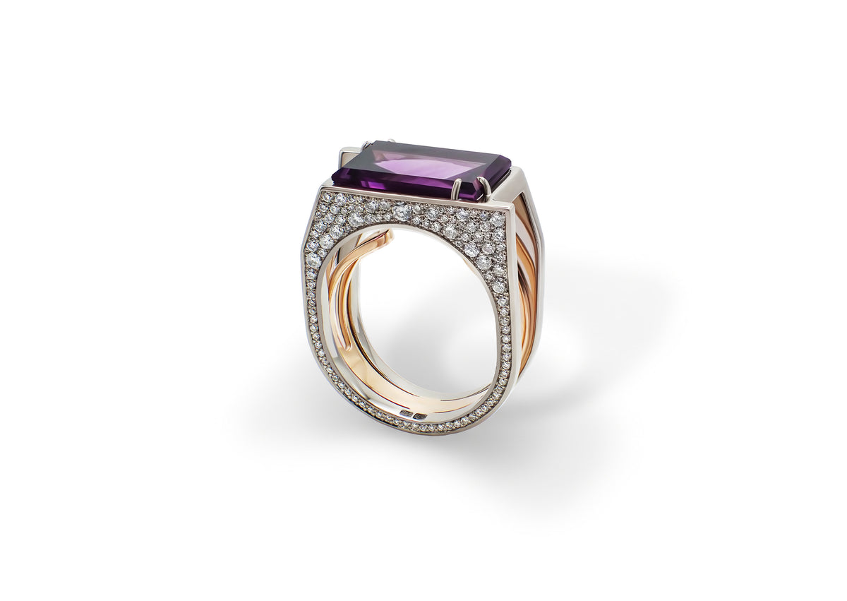 Oumuamua Ring shown at an angle, the baguette-cut amethyst framed by a diamond snowflake pavé.