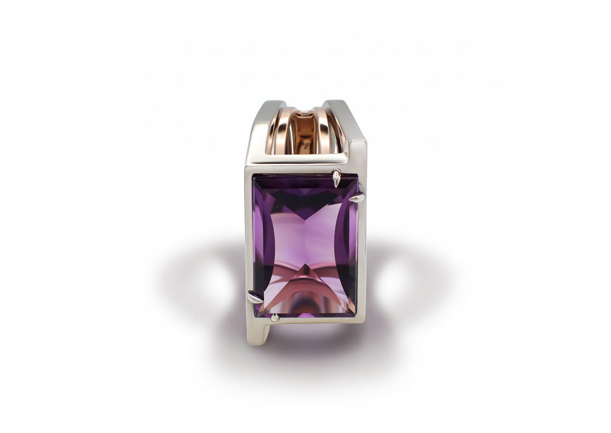 Oumuamua Ring viewed from another angle, highlighting the sculptural gold architecture around the amethyst.