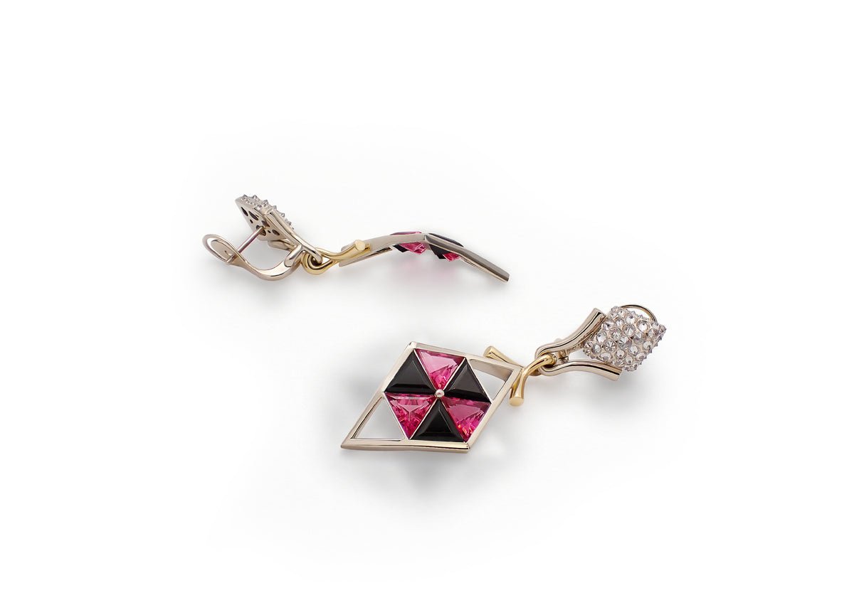 Pavo Nexus Earrings shown at an angle, pink tourmalines and black onyx set with reverse-set diamonds in beige gold.