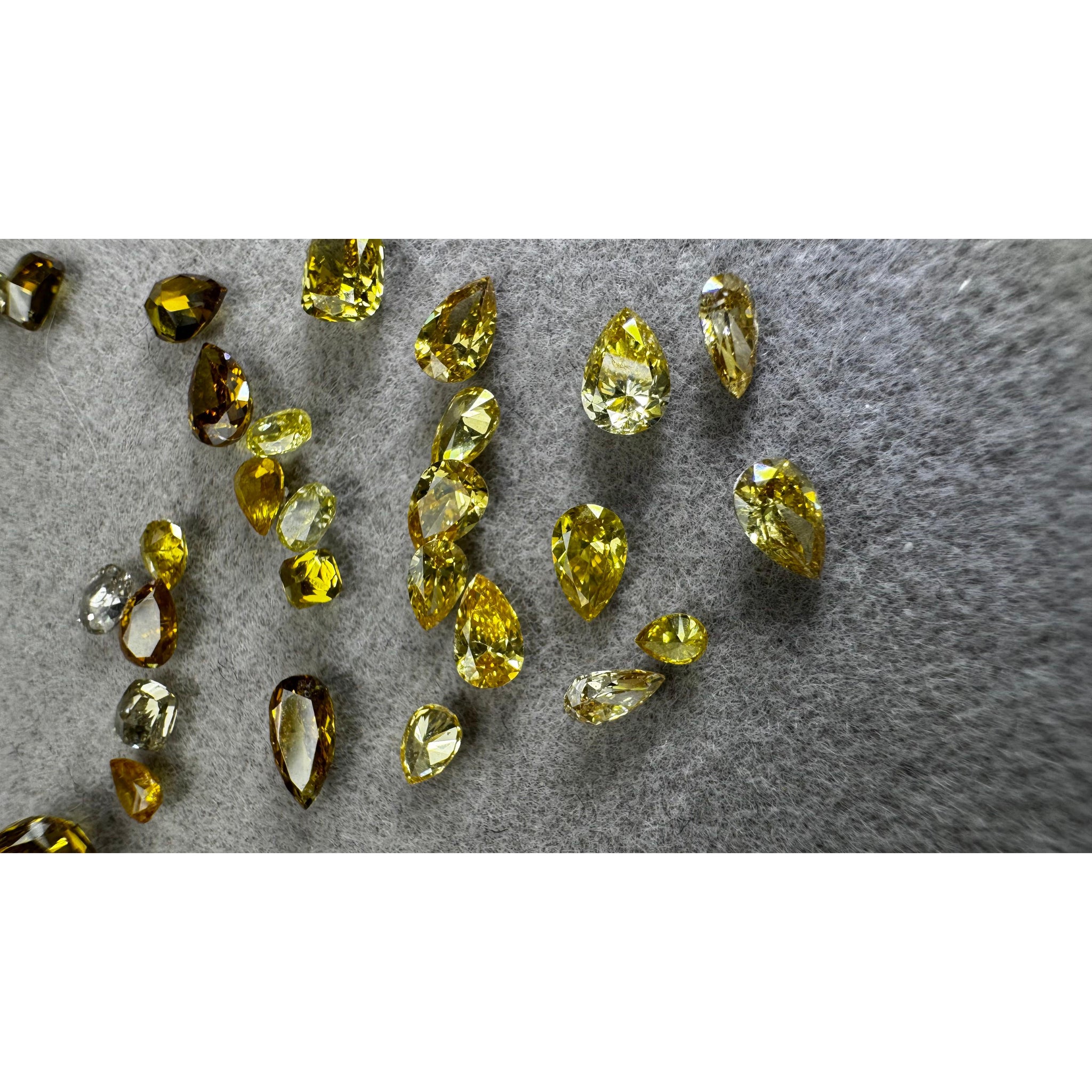 Yellow Diamonds laid on felt