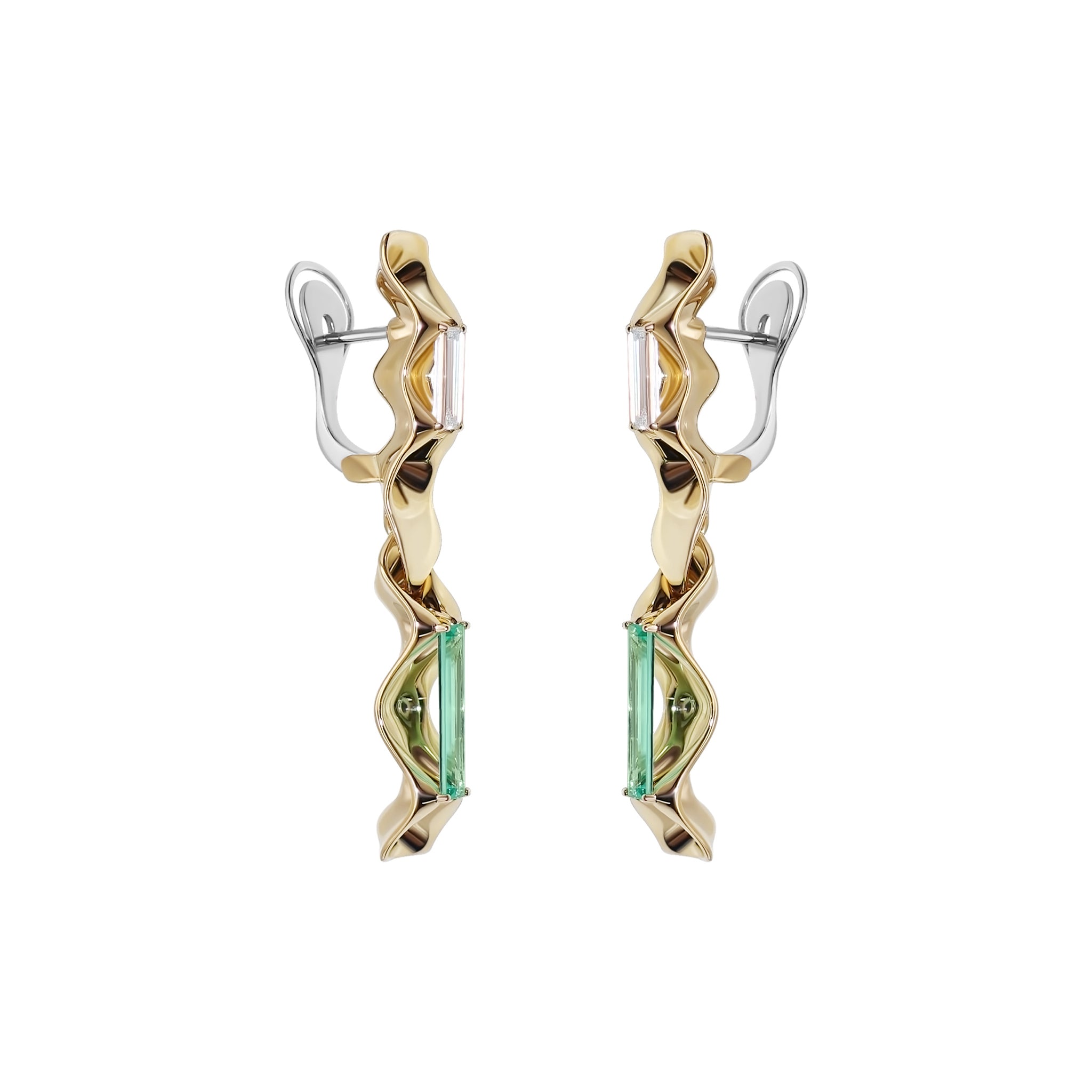 A pair of Equinox Auriga earrings featuring a sculptural design with a combination of palladium white gold and yellow gold, including baguette-cut diamonds and emeralds. Equinox Auriga Earrings by Hugo Cahill featuring baguette cut diamonds and emeralds in sculptural gold
