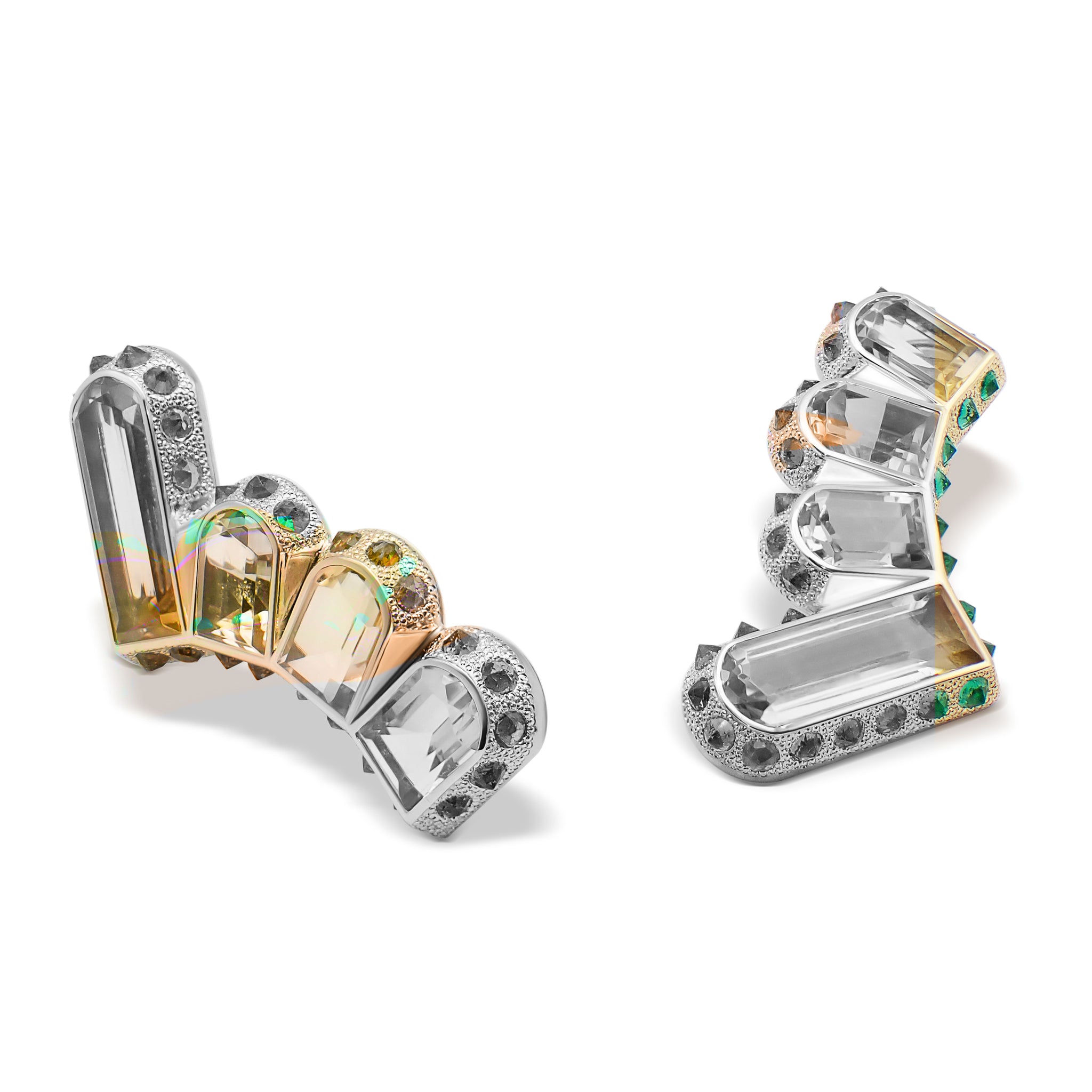 Detail of Hyperborea Earrings highlighting granular emerald setting around citrine
