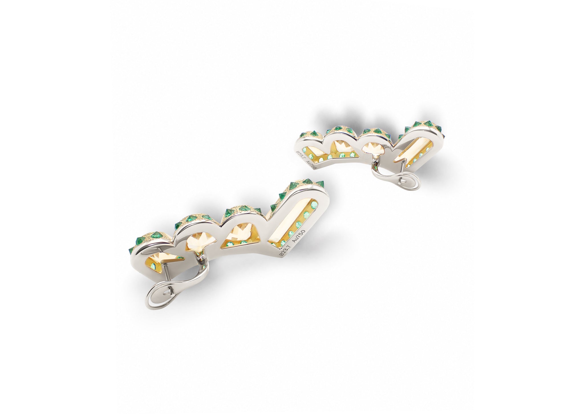 Hyperborea Earrings shown from another angle, highlighting the reverse-set emeralds along the gold structure.