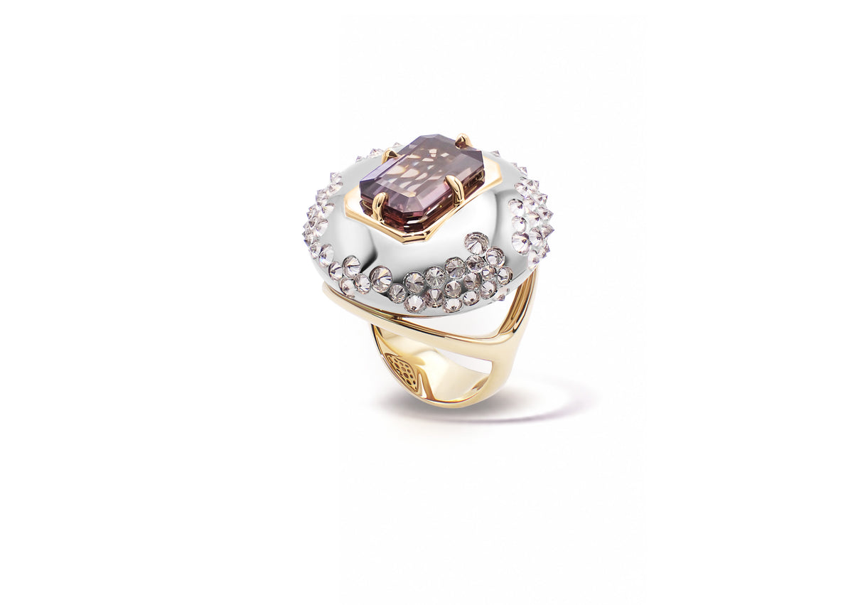 Ophiuchi Tanzanite Ring photographed in isolation, the grey tanzanite set beneath an arched palladium white gold dome.