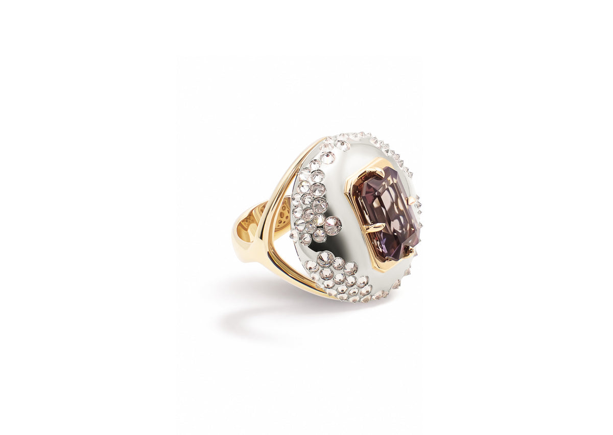 Ophiuchi Tanzanite Ring shown in side view, the arched dome of inverted diamonds framing the tanzanite.