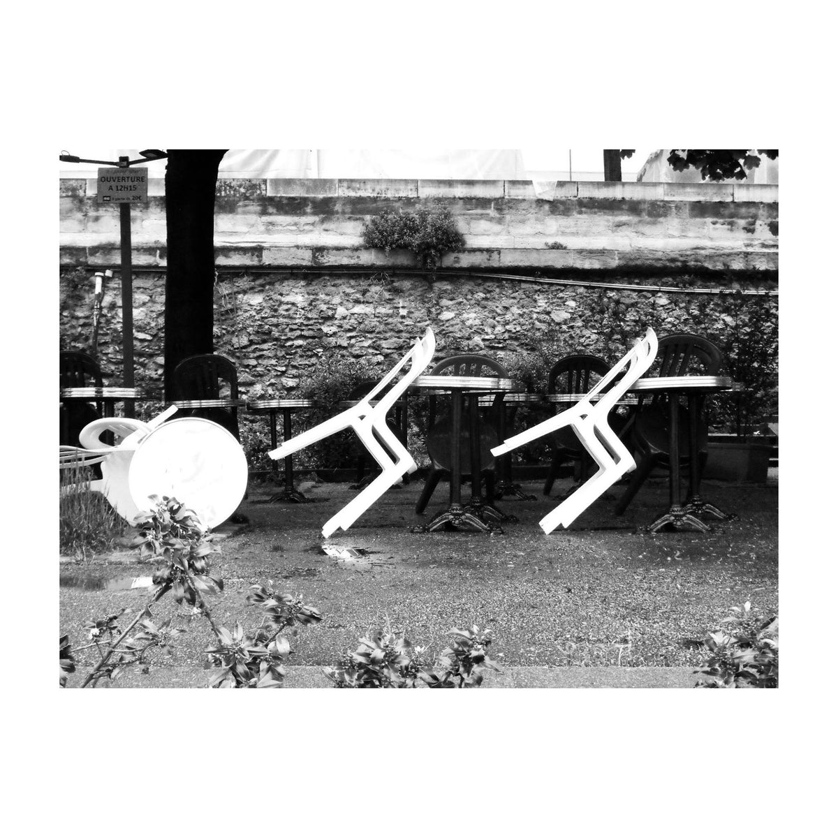 Conceptual reference image accompanying the Eos Apex Earrings from the Renaissance Collection of chairs in a black and white image taken by river Seine in paris
