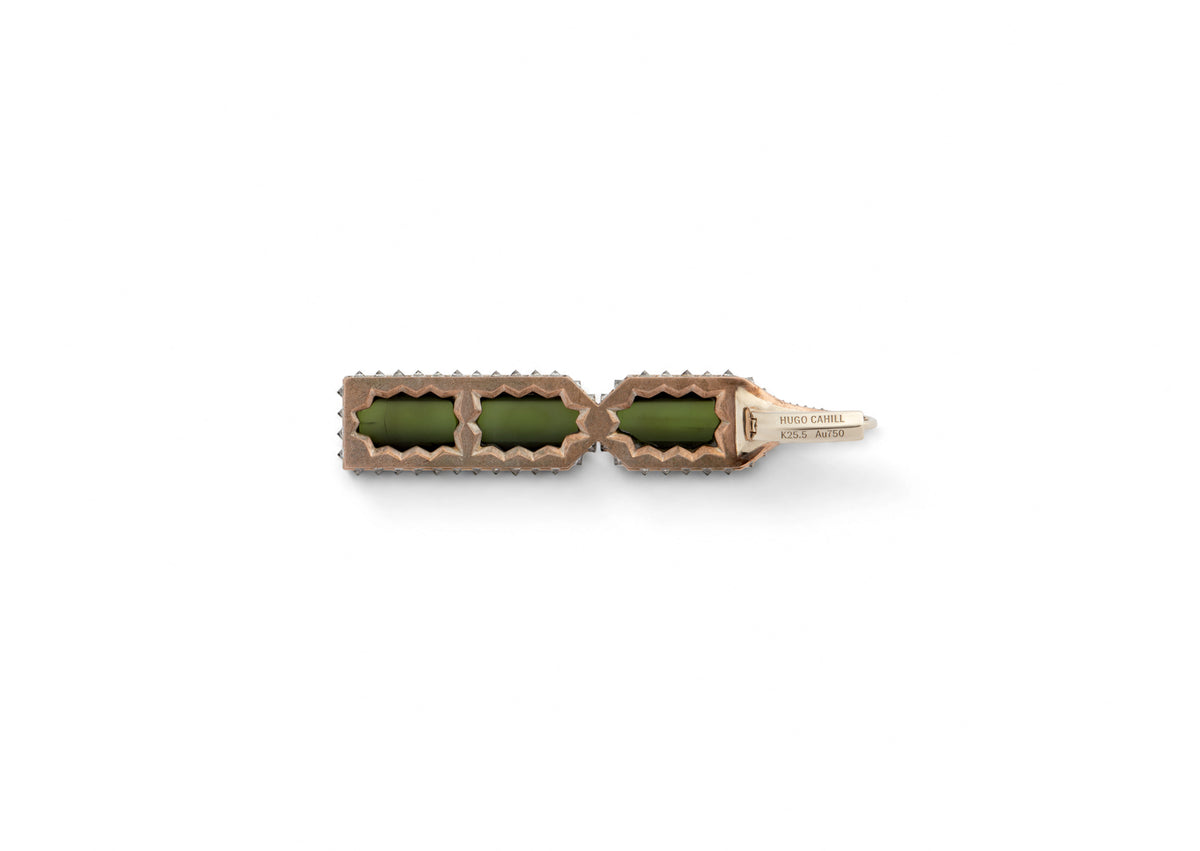Aleutian Precipice Earrings shown from the rear, the elongated tourmaline batons visible against the shibuichi structure.