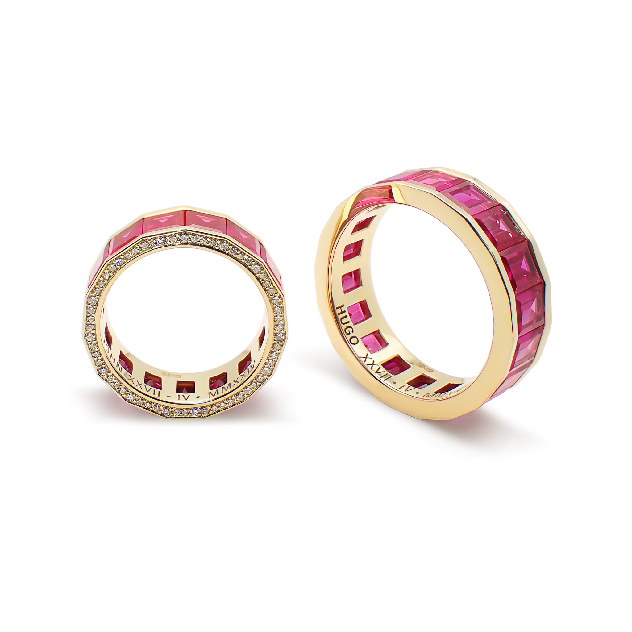 Two gold wedding bands, one with rubies and diamonds on the top half and the other with polished lateral rails. Both are displayed against a white background. Ruby Wedding Bands by Hugo Cahill in gold with portrait-cut rubies, bespoke high jewellery rings

