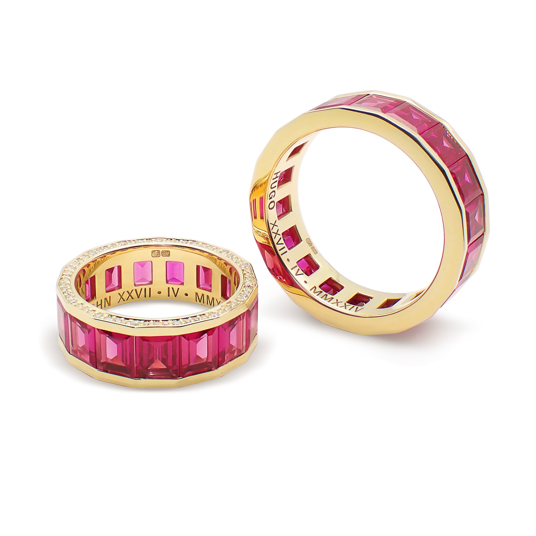 Ruby Wedding Bands showing portrait-cut ruby setting and polished gold surface
