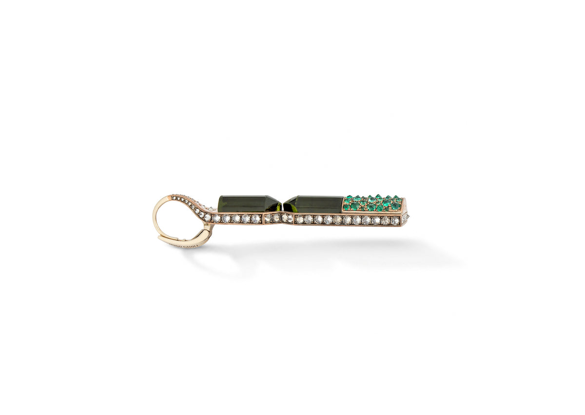 Aleutian Precipice Earrings shown in side view, the emerald pavé visible along the shibuichi hourglass form.
